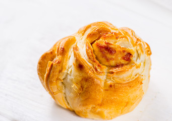Fresh pastries on a white background close-up. Several rolls with filling on a white background