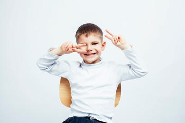 little cute boy on white background gesture smiling close up, lifestyle people concept