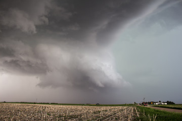 A wall cloud gathers under the base of a supercell storm in the great plains.