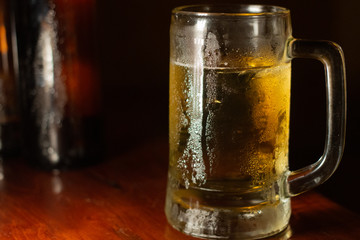 glass of beer with water drop