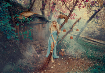 The good sorceress, the Cinderella's fairy godmother, dances and sings while cleaning up the...