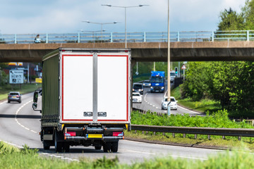 curtain side lorry truck on uk motorway in fast motion