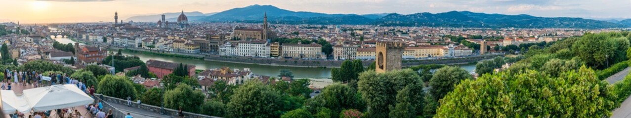 Long panoramic view of Florence from Piazzale Michelangelo.  Cityscape panorama with the Arno river, basilica, cathedral, Palazzo Vecchio