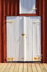 Obraz na płótnie Canvas Old gray wooden garage door 