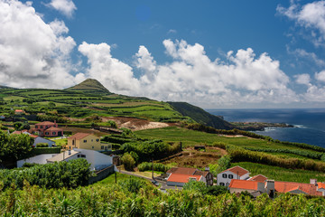 Fototapeta na wymiar labdscape at the azores, panorama of the countryside and cliff over the sea in azores islands. portugal