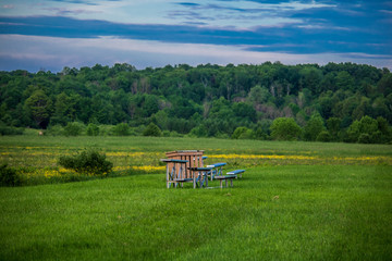 Lonely bleachers in a field of green