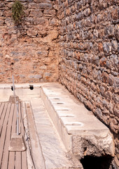 Public toilet in the ancient city of Ephesus in Izmir, Turkey.