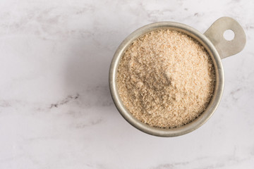 Spelt Flour in Measuring Cup