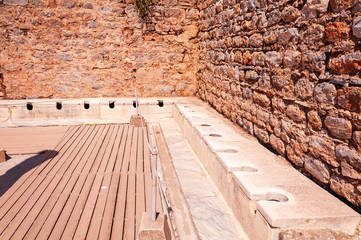 Public toilet in the ancient city of Ephesus in Izmir, Turkey.