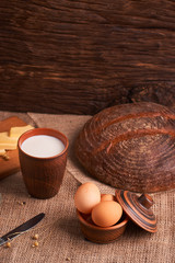 organic dairy products - milk, cheese, and also eggs, bread. on table