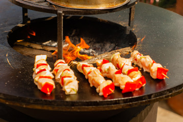 small satay on wooden skewers fried on a brazier close up