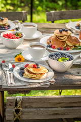 Pancakes in the garden for breakfast in summer garden