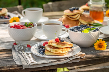 Closeup of pancakes in summer garden for breakfast