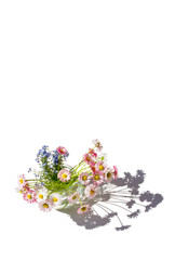 Flowers in a vase with a clear shadow on a white background isolated