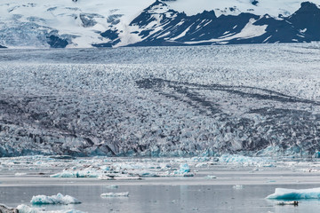 Fototapeta na wymiar Melting tongue of the Breidamerkurjokull glacier summer season white ice