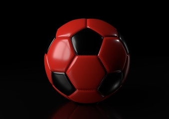 Naklejka premium Classic red black soccer ball isolated on black background. 3d render illustration