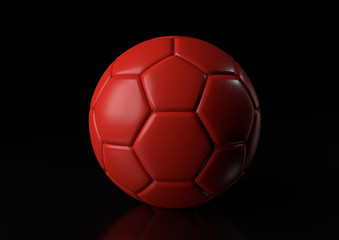 Fototapeta premium Classic red soccer ball isolated on black background. 3d render illustration