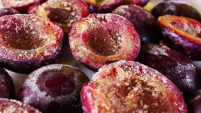 Half cut plum texture pirple healthy fruits on rotating plate