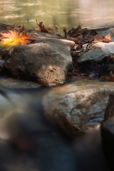 seaside with many rock, long exposure. long exposure of sea and rocks, aegean sea. ong exposure of stream and stony river