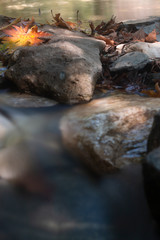 seaside with many rock, long exposure. long exposure of sea and rocks, aegean sea. ong exposure of stream and stony river