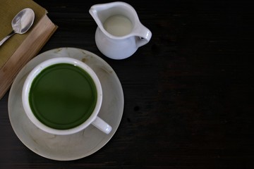 cup of green tea on table