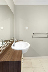 Fototapeta na wymiar Grey and white interior-done bathroom