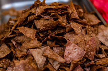 multicolored chips from potatoes background
