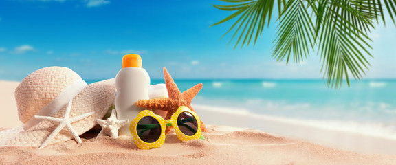 Sunblock Bottle on the tropical beach and sunshine