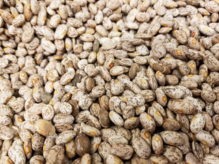 Abstract background of a pile of pinto beans or speckled beans in a grocery store