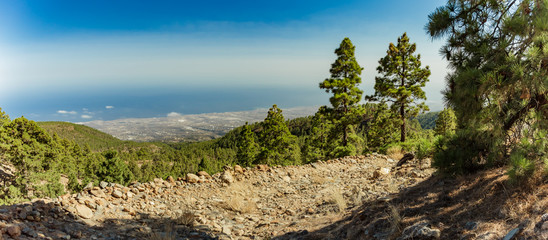 Fototapeta premium magical sunset above the clouds in the mountains. View of south coast line on Tenerife. 2500m altitude. Canary Islands, Spain