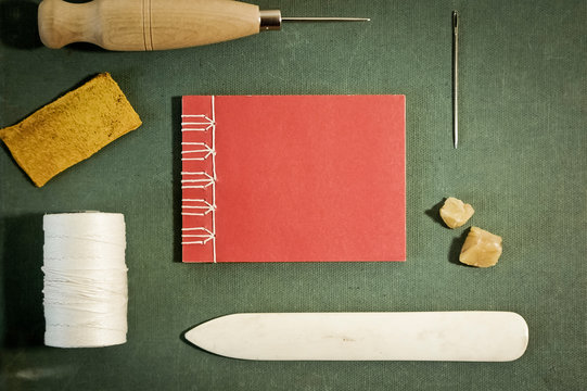 Bookbinding Tools with Hand Sewn Book Viewed from above