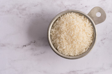 Shredded Coconut in a Measuring Cup