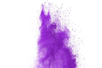 Purple color powder explosion cloud on white background.Closeup of purple dust particles splash on background. 