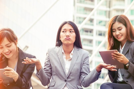 Woman is being ignored from friends who on mobile and tablet on line