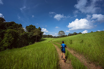 Asian men are running a trail In the natural path