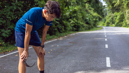 Asian men are tired from running.