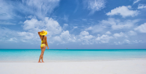 Vacation travel bikini woman on Caribbean beach - sexy woman looking at water