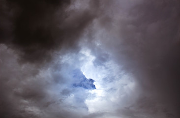 Dark gray dramatic sky with large clouds before rain.