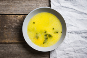 Hot pea soup with spices on the rustic background. Selective focus. Shallow depth of field.