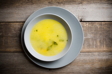 Hot pea soup with spices on the rustic background. Selective focus. Shallow depth of field.