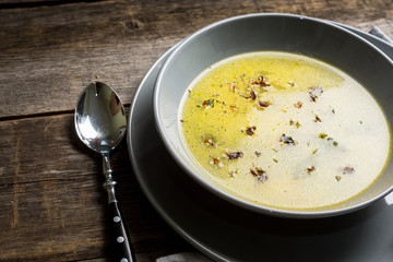 Hot pea soup with spices on the rustic background. Selective focus. Shallow depth of field.