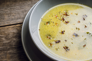 Hot pea soup with spices on the rustic background. Selective focus. Shallow depth of field.
