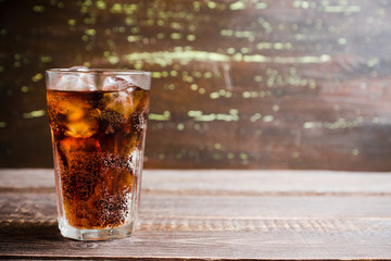 Refreshing cold cherry cola on the wooden background. Selective focus. - obrazy, fototapety, plakaty