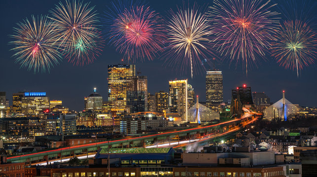 Multicolor Firework Celebration over Scene of Boston skyline which can see Zakim Bridge and Tobin Bridge with express way over the Boston Cityscape, 4th of July and Independence day concept