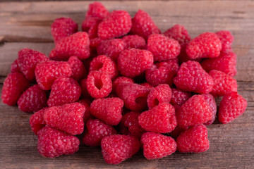 Sweet fresh organic raspberries background close-up. Fresh and sweet raspberries background