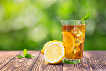 glass of ice tea on wooden table