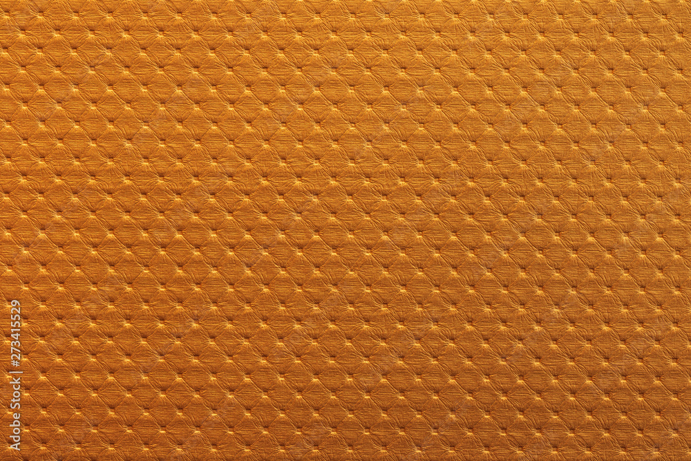 Poster orange leather texture background with tile pattern. detail of luxury sofa surface.