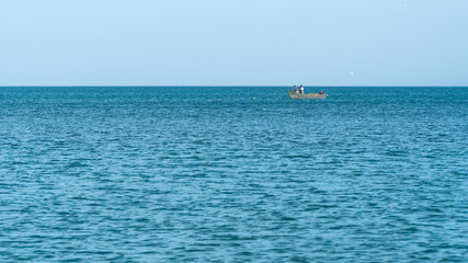 Boat with fishermen on the high seas