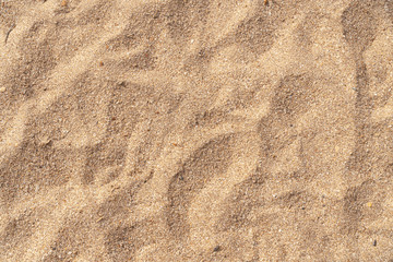 Fototapeta na wymiar Yellow sea sand background texture