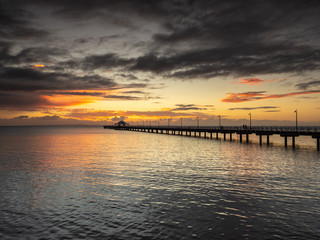 Fototapeta na wymiar Pier Sunrise with Beautiful Sky